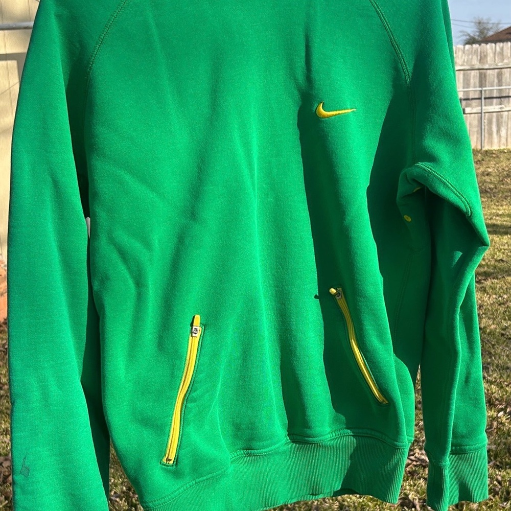 Nike Men's Green Sweatshirt Hoodie with Yellow and Pink Accents.